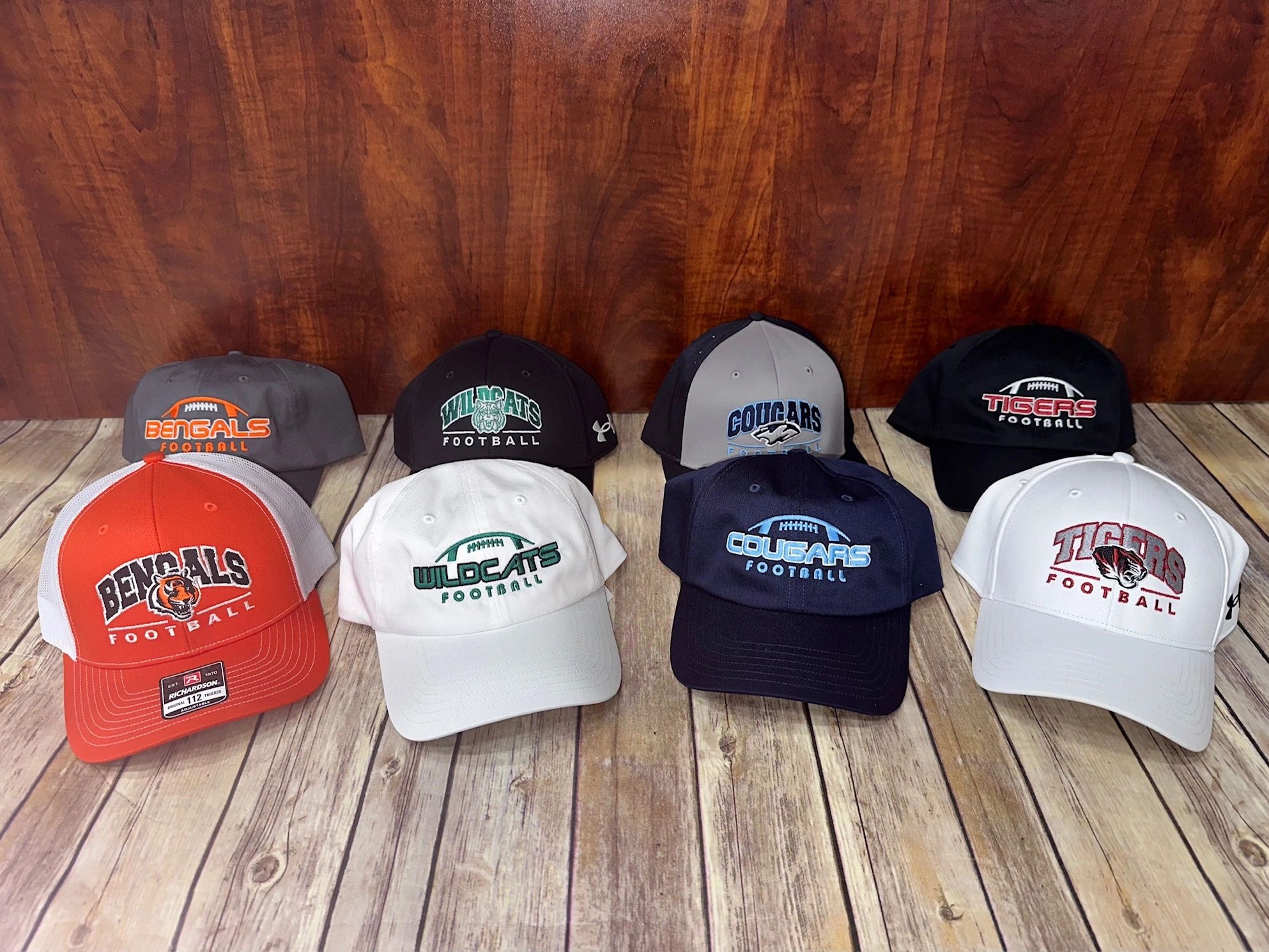 Custom team caps on wood display